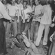 A mob of white teenagers kick and beat an African-American man, who holds his head and screams in pain during a lynching, 1950.
Afro American Newspapers/Gado/Getty Images